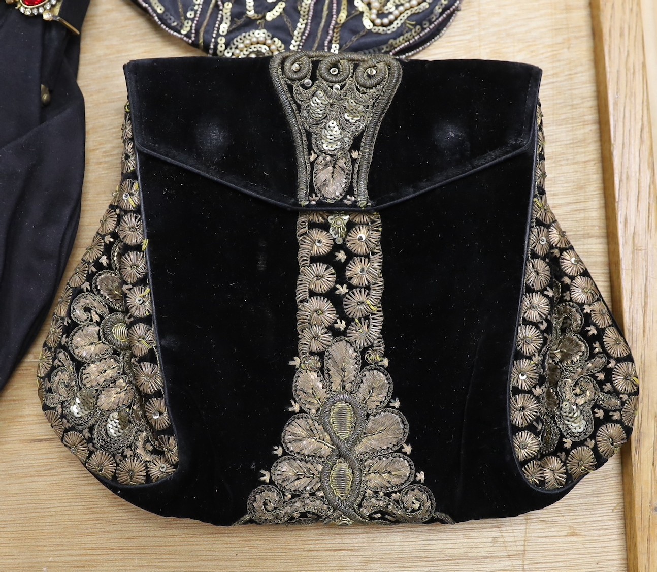 A 1930’s evening bag with silver frame, seven 1930’s-40’s evening bags with diamante encrusted Bakelite frames and clasps, a costume jewelled bag and two gilt and sequin bags